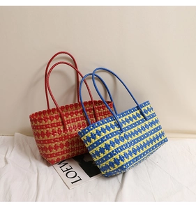 Detail of colorful woven tote bags showing intricate cross-weave texture and sturdy handles