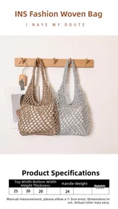 Detail view of handmade hollow straw bags in bronze and silver hanging on wooden hooks