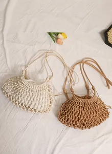 Detail of hollow woven shoulder bag with removable drawstring liner and cotton rope texture