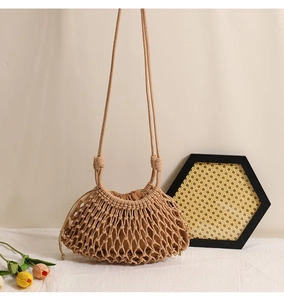 Detail of hand-woven beige cotton rope bag featuring hollow mesh and drawstring lining