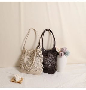 Detailed close-up of handmade crochet hollow mesh beach bag with cotton rope lattice weave