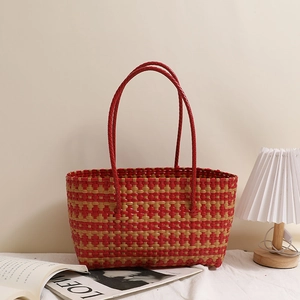 Fashionable woven tote bag with red and gold stripes for beach vacations and shopping