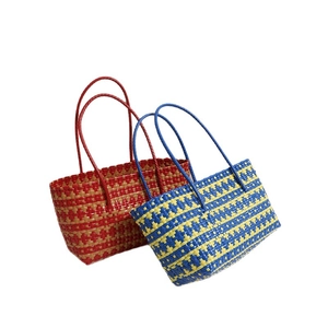 Handmade woven plastic tote bags in red-brown and blue-yellow stripes for beach vacation