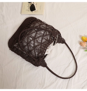 Close-up of deep brown hand-woven hollow tote bag with a white drawstring canvas inner liner