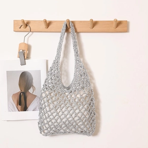 Minimalist silver crochet straw tote bag with inner lining for beach vacations