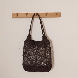 Deep brown oversized macrame woven tote bag with hollow grid pattern for beach vacations