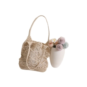 Bohemian beige woven crochet tote bag with geometric hollow pattern for beach vacation