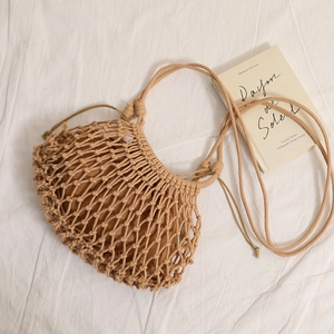 Bohemian khaki hand-woven cotton mesh crossbody bag with drawstring liner for summer beach