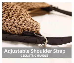 Detail of adjustable PU leather shoulder strap with silver buckle on woven straw bag