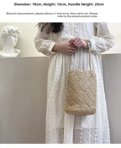 Detailed view of hand-woven straw bucket bag showing size dimensions and crochet texture