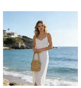 Detailed view of the hollow weave texture on this natural straw beach shoulder bag