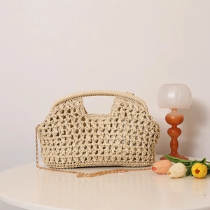 Beige hollow straw crossbody bag with golden chain strap for summer beach vacation