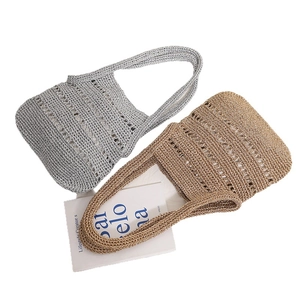 Hollow straw shoulder bag in silver and khaki weave for beach vacations and summer travel