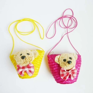 Set of two mini woven straw crossbody bags with cute plush bear and bow detail