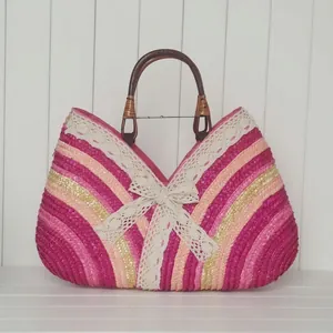 Colorful wheat straw tote bag with lace bow and wooden handles for beach vacation