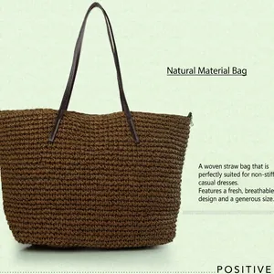 Handcrafted brown straw tote bag with slim leather handles for summer beach outings