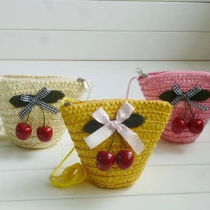 Cute cherry straw crossbody bags in white, yellow, and pink colors for beach vacations