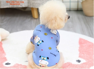 Close-up of light blue pet hoodie with cute baby cow pattern and ribbed cuff detail