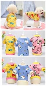 Detail of warm dog hoodies featuring cartoon car, cow, and rainbow prints with ribbed cuffs
