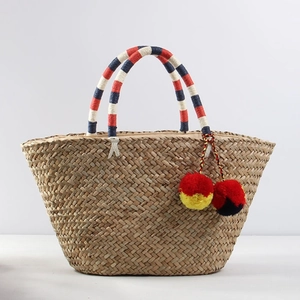 Bohemian large straw tote bag with colorful pompom charms and braided shoulder handles