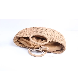 Minimalist straw woven bucket handbag with round handles and drawstring closure