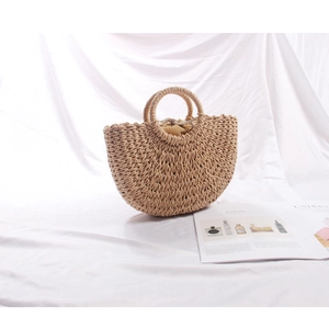 Detailed texture of the crescent straw handbag with paper rope weaving and inner lining