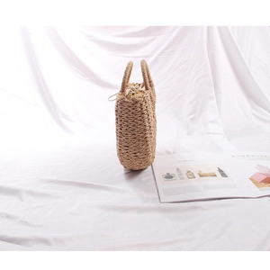 Minimalist semi-circle straw handbag for beach vacations with woven double handles