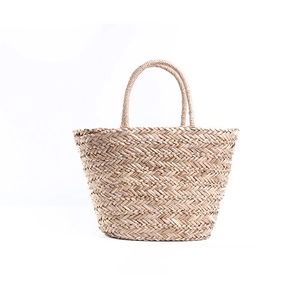 Large woven straw beach tote bag with top handles for summer vacation and travel