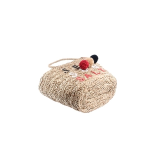 Large straw beach tote with pom-poms and SEA SALT embroidery for summer vacation