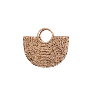 Minimalist straw bucket bag with half-moon shape and round top handles for summer