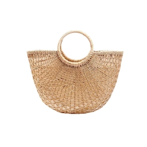Handmade semi-circular straw tote bag with round handles and inner fabric lining