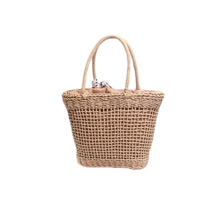 Chic hollow trapezoid woven straw handbag with black and white polka dot silk scarf detail