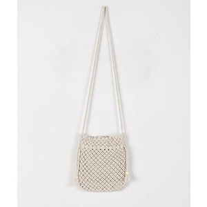 Detail of crochet crossbody bag featuring cream woven mesh and decorative wooden beads