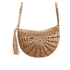 Handmade straw crossbody bag with decorative tassel and metal zipper for beach vacation