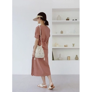 Elegant bean paste pink cotton dress paired with white woven bucket bag and sun hat