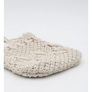 Handmade cream macrame shoulder bag with intricate woven diamond patterns and cotton cord