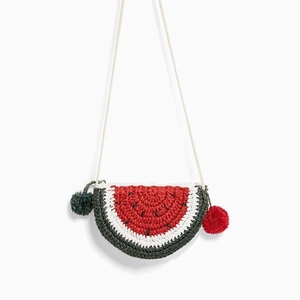 Handmade crochet watermelon shoulder bag for kids with pompom charms and red seeds