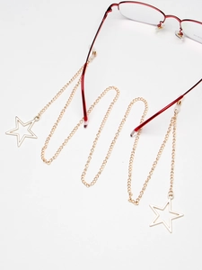 Chaîne à lunettes dorée avec pendentif étoile et boucles antidérapantes sur blanc