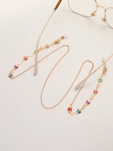 Chaîne à lunettes dorée avec papillons colorés et boucles en silicone réglables