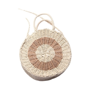 Handmade round straw woven handbag for beach vacation featuring dual-tone circular patterns
