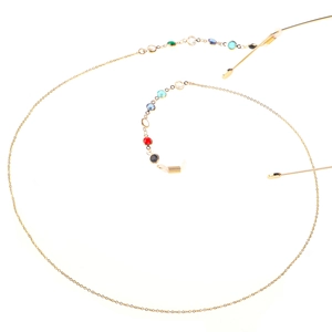 Detail view of gold eyewear chain with colorful round gemstones on a white background