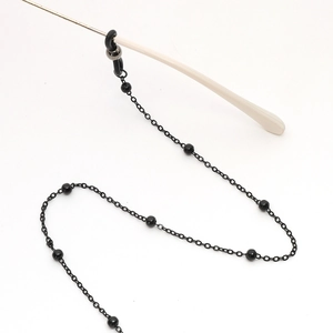 Minimalist black beaded glasses chain with anti-slip silicone loops on white background