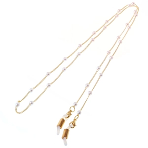 Detail of elegant gold chain with white faux pearls and silicone loops for glasses