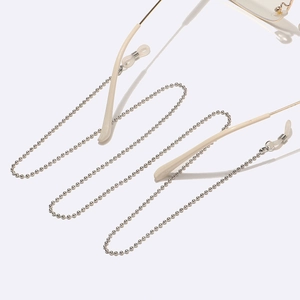 Close-up of silver metal beaded eyewear chain with transparent silicone anti-slip loops