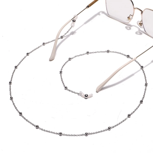 Detail of silver beaded eyewear chain with transparent silicone loops and metal beads