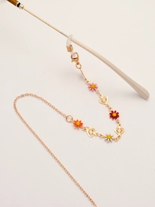 Goldene Brillenkette mit bunten Gänseblümchen-Anhängern und hohlen Herz-Elementen