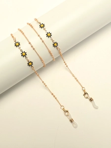 Golden eyewear chain with yellow daisy charms and white silicone loops for glasses