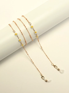 Golden eyewear chain with white daisy enamel charms and silicone loop connectors