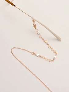 Gold glasses chain with hollow stars, hearts and pearls, featuring silicone ends