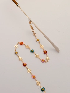 Golden eyewear chain with colorful enamel daisies and hollow heart-shaped metal charms